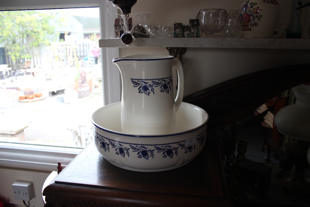 A blue and white china toilet jug and basin, a flo