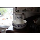 A blue and white china toilet jug and basin, a flo