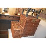 A painted wood stand and two wicker baskets