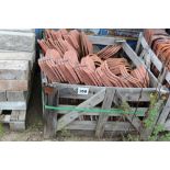 A stillage of loose shaped concrete and other tile