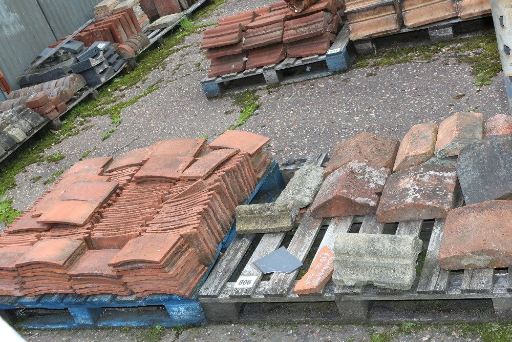 A quantity of terracotta peg tiles, wall capping e