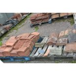 A quantity of terracotta peg tiles, wall capping e