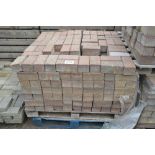 A pallet of paving bricks