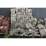 A pallet of capping and bricks