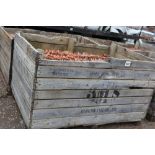 A large crate of terracotta pantiles