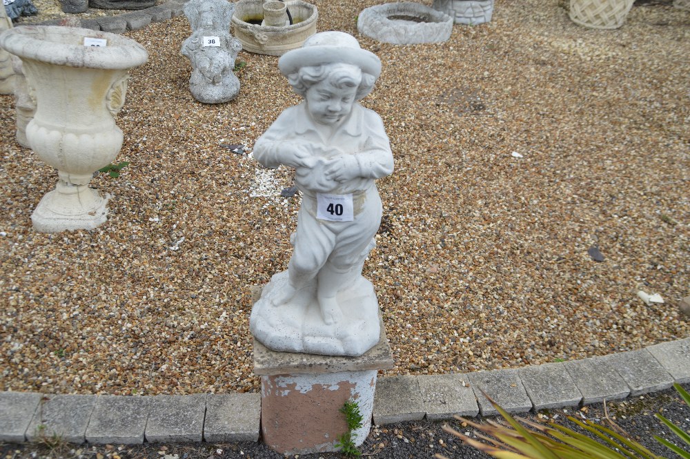 A pre-cast garden ornament in the form of a child,