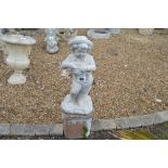 A pre-cast garden ornament in the form of a child,