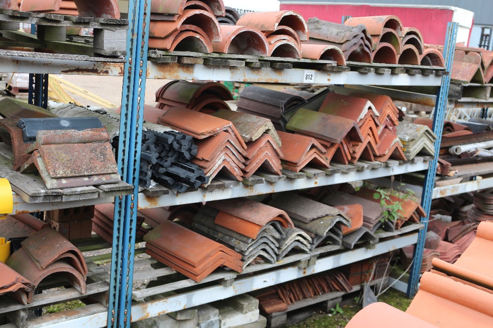 A large quantity of terracotta ridge tiles, concre