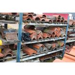 A large quantity of terracotta ridge tiles, concre