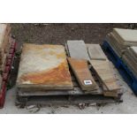 A pallet containing large stone slabs and smaller