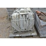 A crate of stoneware paving slabs, various sizes