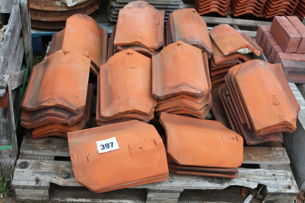 A pamment of red roof tiles