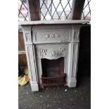 A cast iron Art Nouveau bedroom fireplace