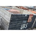 A crate of concrete roofing tiles