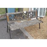 A timber and cast garden bench, width approx. 126cm,