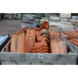 A large crate of roofing tiles