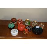 A collection of coloured glass paper-weights, smal