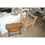 An old pine elbow chair and an oak coffee table