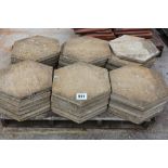 A pallet of octagonal concrete hexagonal slabs