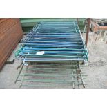 A quantity of galvanised and painted metal fencing