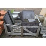 A crate containing slate tiles