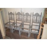 Four painted spindle back dining chairs, (seats in