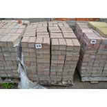 A pallet of paving bricks