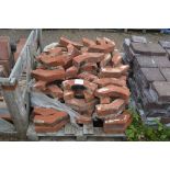 A pallet of chimney red bricks