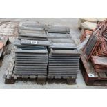 A pallet of concrete roof tiles