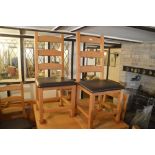 A set of six pine ladder back dining chairs