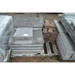 A quantity of large concrete copping stones togeth