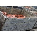 A crate of shaped terracotta pantiles