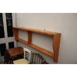 A stripped pine hanging wall shelf, an oak tea tro