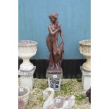A bronzed effect pre-cast garden statue of a woman