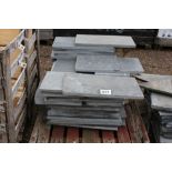 A pallet containing various sized slate slabs