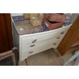 A painted chest of three drawers