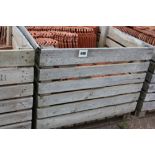 A crate of shaped roofing tiles