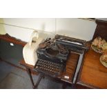 A vintage Royal typewriter and a vintage vanity ca