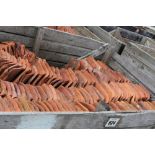 A large crate of terracotta pantiles