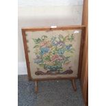 A needlework fire screen