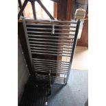 A chrome heated towel rail