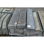 A pallet of concrete curbing