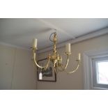 A brass four light chandelier