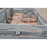 A crate of terracotta pammetts