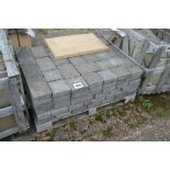 A pallet of concrete block paving