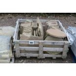 A crate of stone shaped paving slabs