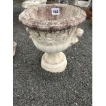 A large round pre-cast planter, approx. 63cm