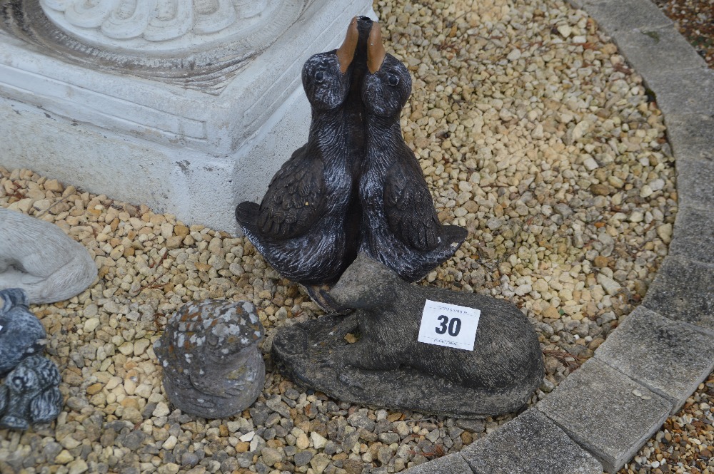 A mixed lot of garden ornaments including an otter