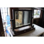 A Victorian mahogany swing toilet mirror