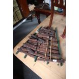 A rosewood xylophone, (in need of re-stringing)